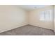 Neutral bedroom with carpet, light walls, and a window bringing in natural light at 8842 Duncan Barrel Ave # 103, Las Vegas, NV 89178