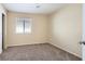 Neutral bedroom featuring modern carpet, natural light, and a serene atmosphere at 8842 Duncan Barrel Ave # 103, Las Vegas, NV 89178