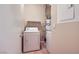 Functional laundry room with appliances and a water heater for convenience at 8842 Duncan Barrel Ave # 103, Las Vegas, NV 89178
