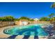 Sparkling community pool surrounded by lush landscaping, perfect for relaxation and recreation at 8842 Duncan Barrel Ave # 103, Las Vegas, NV 89178