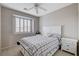Comfortable bedroom features a full bed, window with shutters, and two nightstands for decor at 108 Parker Ranch Dr, Henderson, NV 89012