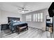 Well-lit bedroom with a ceiling fan, a large bed, and plenty of natural light at 108 Parker Ranch Dr, Henderson, NV 89012