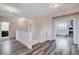 Bright hallway with wood-look floors and white railings overlooks the staircase and leads to several bedrooms at 108 Parker Ranch Dr, Henderson, NV 89012