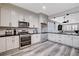 Contemporary kitchen featuring stainless steel appliances, stone countertops and modern cabinetry at 108 Parker Ranch Dr, Henderson, NV 89012