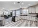 Bright, modern kitchen features an island, stone countertops, and stainless steel appliances at 108 Parker Ranch Dr, Henderson, NV 89012