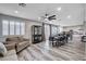 Open-concept living room, connected to the kitchen and dining area, offers ample living space at 108 Parker Ranch Dr, Henderson, NV 89012