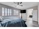 The main bedroom has a neutral color palette, recessed lighting, and an ensuite bathroom at 108 Parker Ranch Dr, Henderson, NV 89012