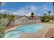 Sparkling pool with attached jacuzzi and landscaping. Perfect for outdoor enjoyment and relaxation at 108 Parker Ranch Dr, Henderson, NV 89012