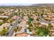 Community aerial view displays residential homes, desert landscaping, and orderly street layouts, emphasizing community development at 161 Swale Ln, Las Vegas, NV 89144