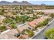 Residential aerial view features desert landscaping, solar panels, and mountain views showcasing community appeal at 161 Swale Ln, Las Vegas, NV 89144