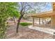 Spacious backyard featuring a covered patio and landscaped area at 161 Swale Ln, Las Vegas, NV 89144
