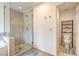 Modern bathroom with a glass-enclosed shower and a separate toilet area for privacy and convenience at 161 Swale Ln, Las Vegas, NV 89144