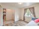 Bedroom featuring a window with curtains and modern flooring, offering a cozy space at 161 Swale Ln, Las Vegas, NV 89144