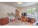 Bedroom featuring lots of light and wood laminate flooring at 161 Swale Ln, Las Vegas, NV 89144