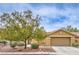 Charming single-story home with mature landscaping, well-maintained lawn and inviting curb appeal at 161 Swale Ln, Las Vegas, NV 89144
