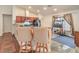 Kitchen featuring bar seating with granite countertops, stainless steel appliances, and ample cabinet space at 161 Swale Ln, Las Vegas, NV 89144