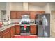 Bright kitchen with modern stainless-steel appliances, granite countertops, and ample cabinet storage at 161 Swale Ln, Las Vegas, NV 89144