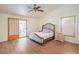 Inviting main bedroom with a sliding door to the outdoor area, complemented by a ceiling fan at 161 Swale Ln, Las Vegas, NV 89144