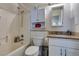 Bright bathroom with white cabinets, granite countertop, and shower-tub combo at 1949 King Hill St, Las Vegas, NV 89106