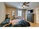 Cozy bedroom with ceiling fan, dresser, and comfortable tiger-themed bedding at 1949 King Hill St, Las Vegas, NV 89106