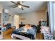 Bedroom with ceiling fan, laminate wood flooring, and a window providing natural light at 1949 King Hill St, Las Vegas, NV 89106