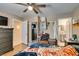 Bright bedroom with wood floors, dresser, and access to the en-suite bathroom at 1949 King Hill St, Las Vegas, NV 89106