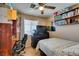 Cozy bedroom features a comfortable bed, workspace, and ample storage with a bookshelf at 1949 King Hill St, Las Vegas, NV 89106