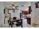 Bright dining area with a table, seating, and open access to the updated kitchen with stainless appliances at 1949 King Hill St, Las Vegas, NV 89106