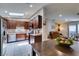 Open kitchen with wood cabinets, stainless appliances, and a skylight for natural lighting at 1949 King Hill St, Las Vegas, NV 89106