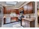This kitchen is filled with natural light and includes stainless steel appliances and dark cabinetry at 1949 King Hill St, Las Vegas, NV 89106