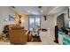 Spacious living room featuring tile flooring, neutral walls, sliding door access to the backyard and backyard access at 1949 King Hill St, Las Vegas, NV 89106