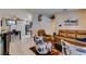 Open-concept living area with a dining table, stainless steel refrigerator, and a cozy seating arrangement at 1949 King Hill St, Las Vegas, NV 89106