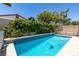 Backyard showcasing a bright pool, mature landscaping, and well maintained surroundings at 1949 King Hill St, Las Vegas, NV 89106