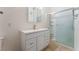 Bathroom featuring a single sink vanity with modern faucet and a glass enclosed shower at 2141 Hussium Hills St # 108, Las Vegas, NV 89108