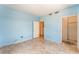 Bedroom with light blue walls, tile floor, and doorway to a closet and laundry room at 2141 Hussium Hills St # 108, Las Vegas, NV 89108