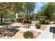 Community picnic area with covered tables and a view of the community pool at 2141 Hussium Hills St # 108, Las Vegas, NV 89108