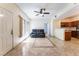Inviting living space with stylish flooring, and a view of the kitchen featuring stainless steel appliances at 2141 Hussium Hills St # 108, Las Vegas, NV 89108