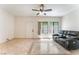 Cozy living room featuring a comfortable sofa, bright light and a ceiling fan for added comfort at 2141 Hussium Hills St # 108, Las Vegas, NV 89108