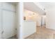 Open living room with tile flooring and view into the dining and hallway areas at 2141 Hussium Hills St # 108, Las Vegas, NV 89108