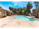Community pool with clear water, surrounded by landscaping and residential buildings on a sunny day at 2141 Hussium Hills St # 108, Las Vegas, NV 89108
