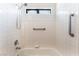 Shower-tub featuring tiled surround, safety bar, and shower head at 2141 Hussium Hills St # 108, Las Vegas, NV 89108