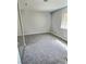 Bright bedroom featuring plush carpet, a window and a mirrored closet at 3619 Edinburgh Dr, Las Vegas, NV 89103