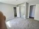 Bedroom featuring plush carpet, a mirrored closet and access to the bathroom at 3619 Edinburgh Dr, Las Vegas, NV 89103