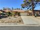 Charming single-story home with a two-car garage, desert landscaping, and a tile roof in a quiet neighborhood at 3619 Edinburgh Dr, Las Vegas, NV 89103