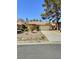 Charming single-story home with a two-car garage, desert landscaping, and a tile roof in a quiet neighborhood at 3619 Edinburgh Dr, Las Vegas, NV 89103