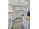 Bright kitchen featuring white cabinets, light countertops, and modern appliances at 3619 Edinburgh Dr, Las Vegas, NV 89103
