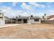 Backyard with patio cover, storage shed, and block wall providing privacy and outdoor living space at 4416 Rip Van Winkle Ln, Las Vegas, NV 89102