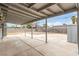 Large backyard featuring a covered patio and block wall, offering plenty of space and privacy at 4416 Rip Van Winkle Ln, Las Vegas, NV 89102