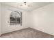 Bedroom with neutral carpet features a bright window looking to the exterior at 4416 Rip Van Winkle Ln, Las Vegas, NV 89102