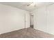 Bedroom features neutral carpet, closet with sliding doors, and adjacent doorway at 4416 Rip Van Winkle Ln, Las Vegas, NV 89102